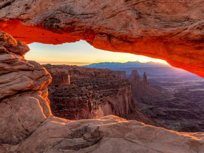 Orange sunrise glow on Mesa Arch