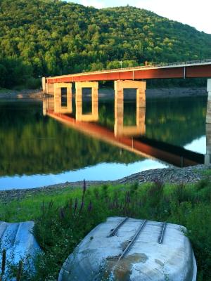 Fishing Boat and Reservoir Bridge